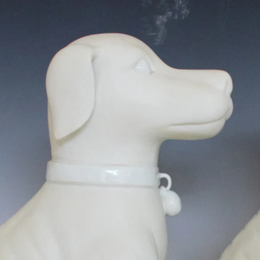 A PAIR OF 11” WHITE DOGS