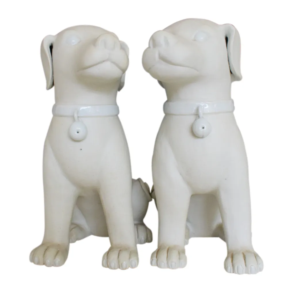 A PAIR OF 11” WHITE DOGS