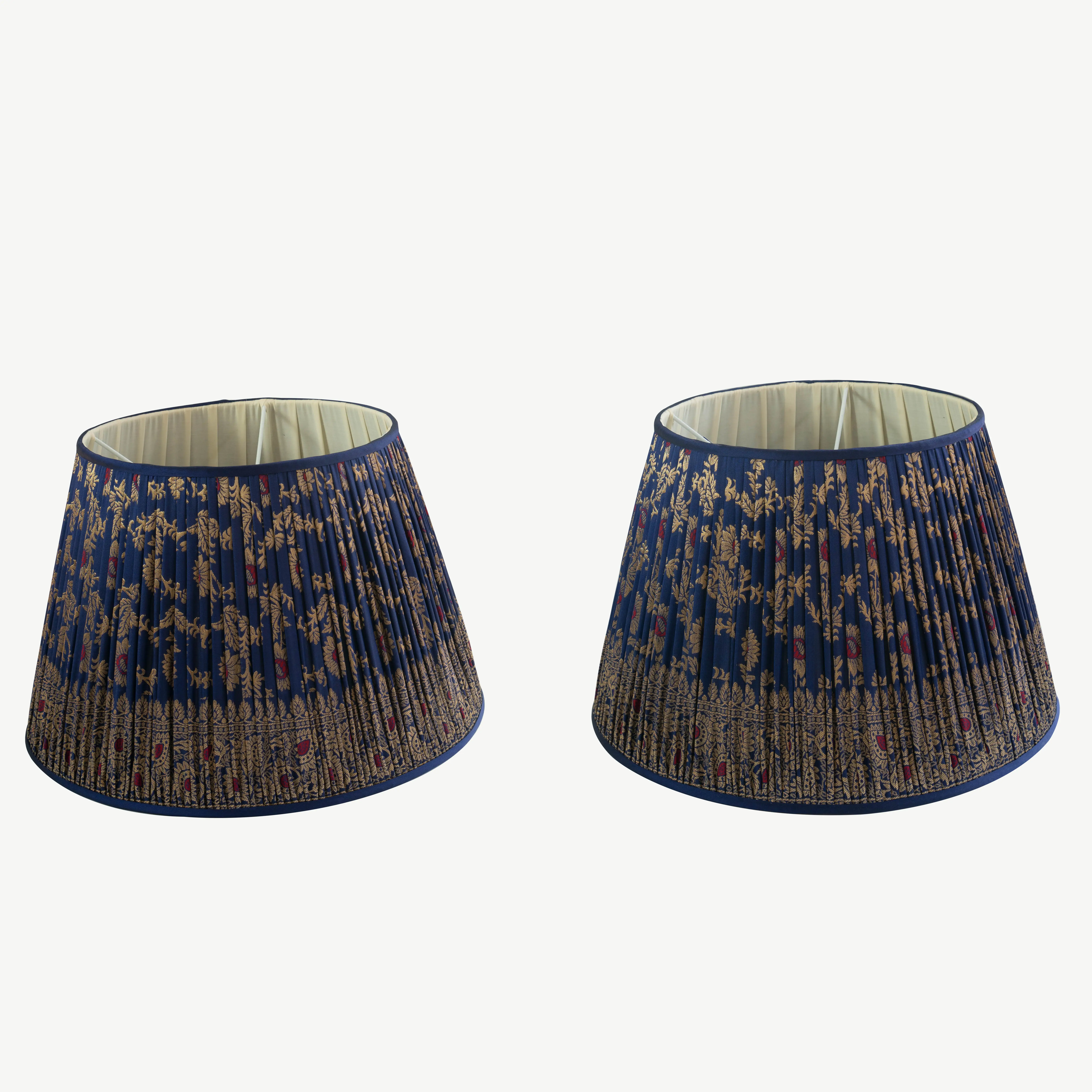 A pair of royal blue lampshades