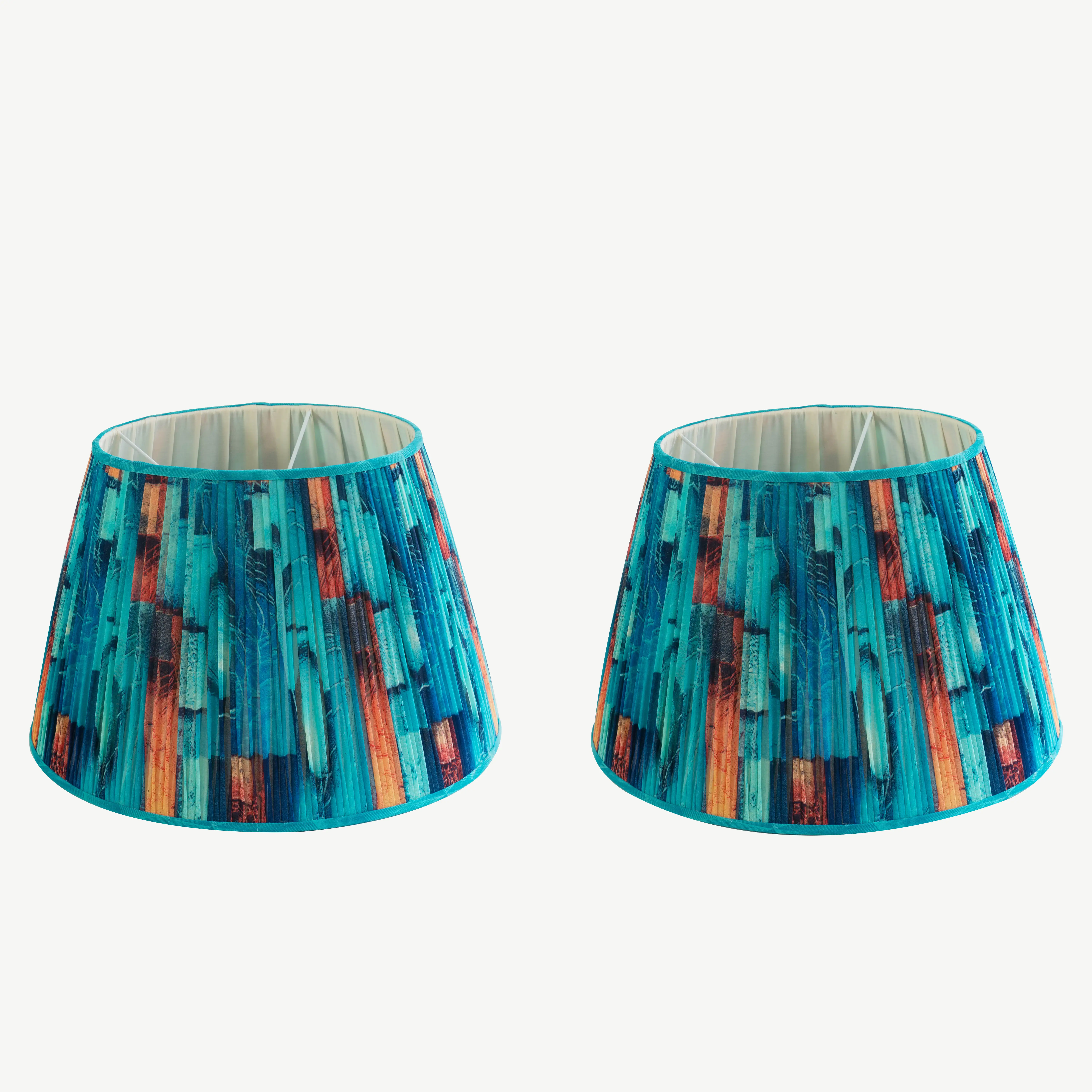 A pair of turquoise and orange lampshades