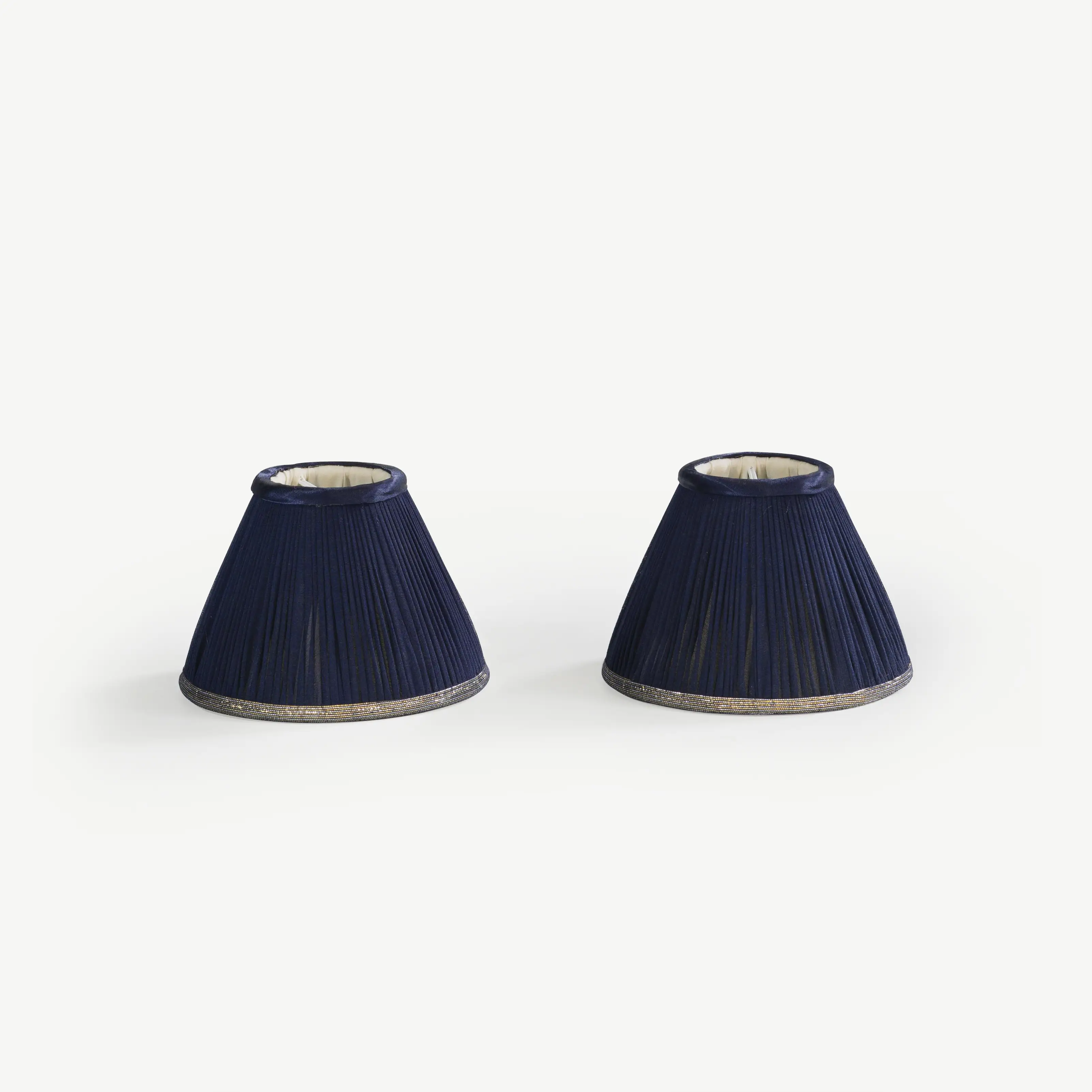 A pair of dark blue lampshades